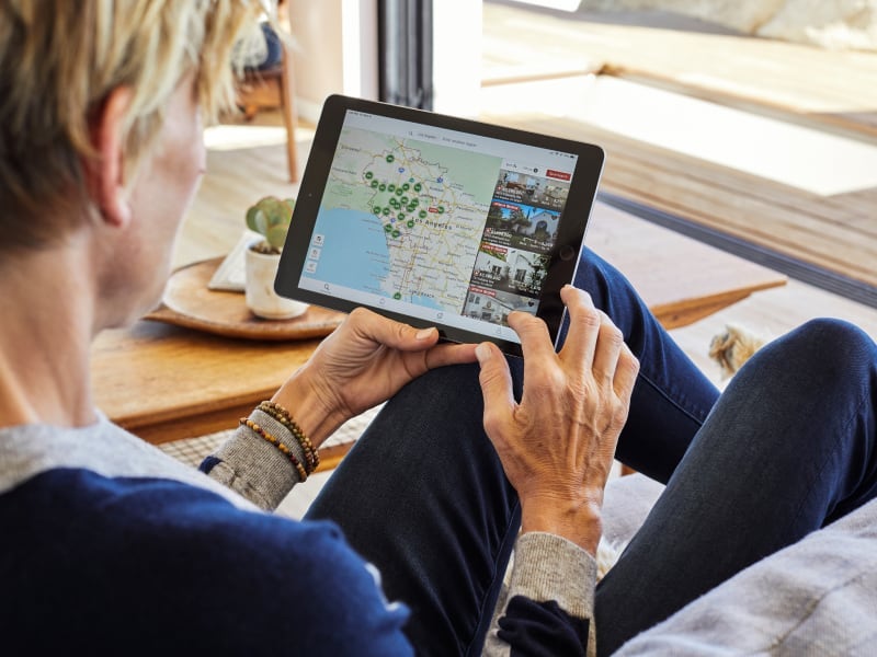 Redfin customer browsing through listings on a tablet