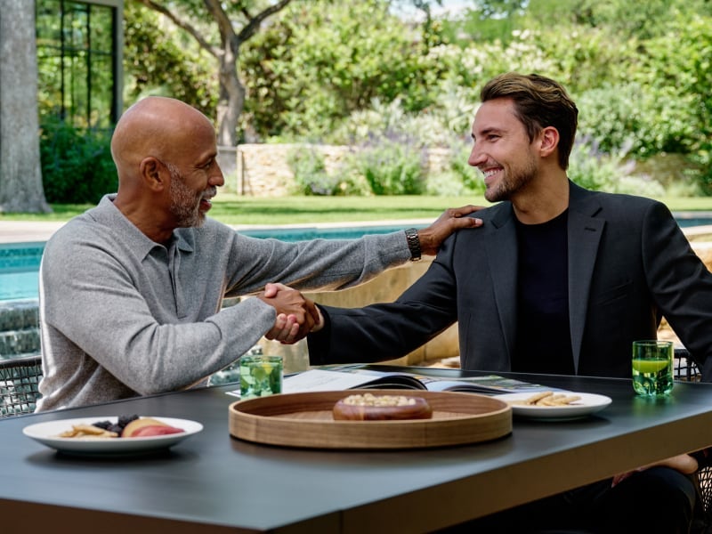 Redfin partner agent shaking hands to close a deal with a customer